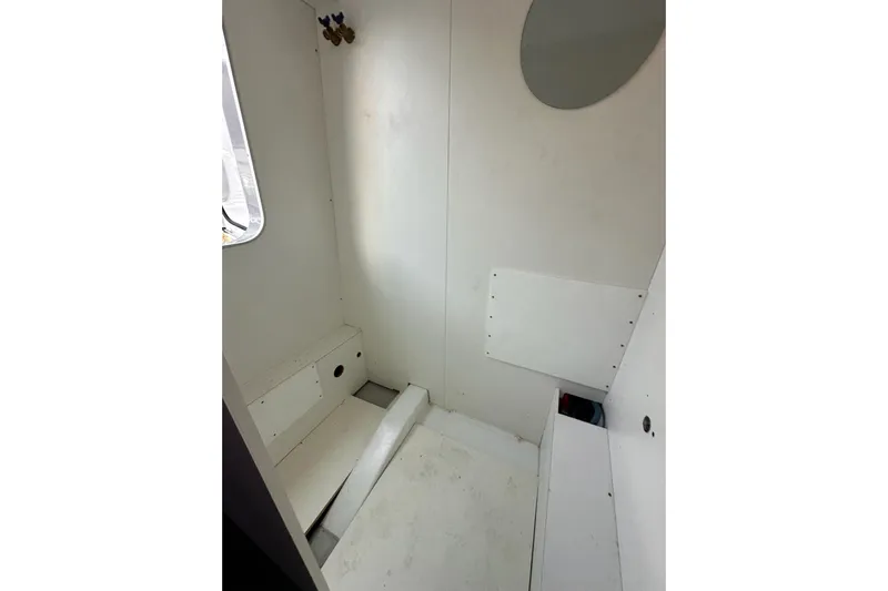 Dove Yacht Photos Pics 2015 Beneteau Swift Trawler 50 interior cabin with white walls and seating.