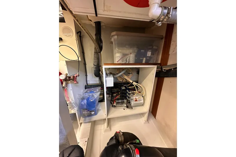 Dove Yacht Photos Pics Engine room of 2015 Beneteau Swift Trawler 50, showcasing wiring and equipment.