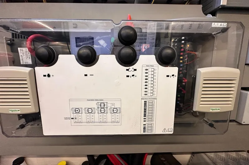 Dove Yacht Photos Pics Electrical panel on a 2015 Beneteau Swift Trawler 50 boat, featuring switches and wiring.