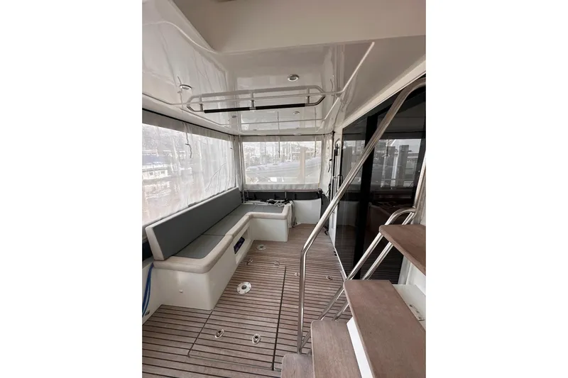 Dove Yacht Photos Pics 2015 Beneteau Swift Trawler 50 interior with seating and wooden flooring.