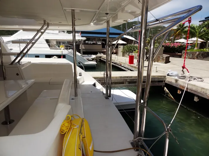 Livitup Yacht Photos Pics 2017 Leopard 43 Powercat docked at marina, featuring spacious deck and modern design.