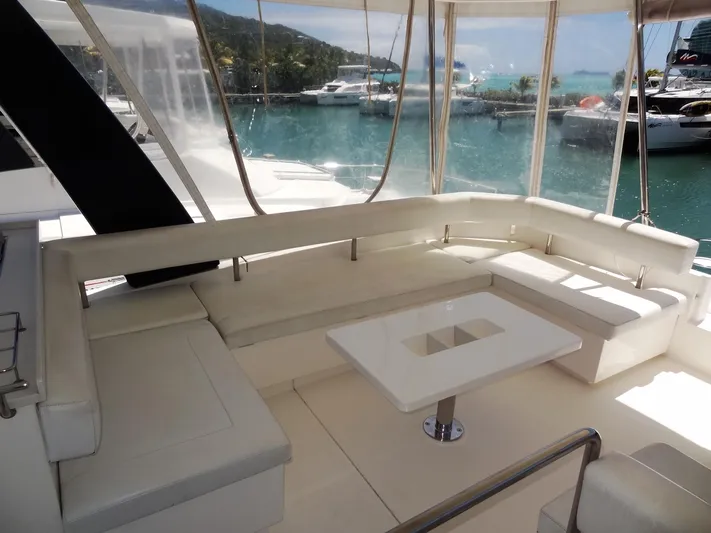 Livitup Yacht Photos Pics Luxurious seating area on 2017 Leopard 43 Powercat yacht, docked in a marina.