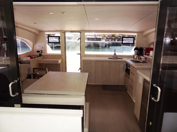 Livitup Yacht Photos Pics Interior of 2017 Leopard 43 Powercat yacht, featuring modern kitchen and dining area.