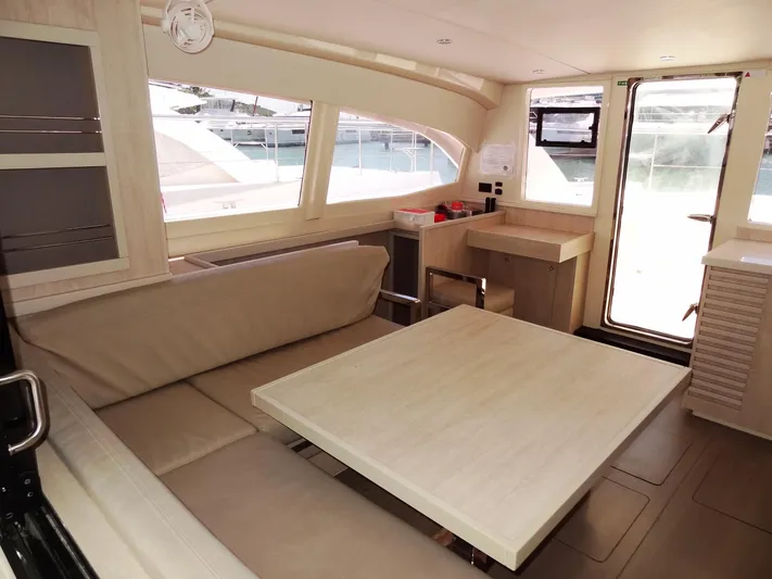 Livitup Yacht Photos Pics 2017 Leopard 43 Powercat interior with beige seating and table, modern design.