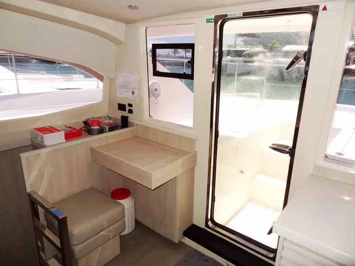 Livitup Yacht Photos Pics Interior of 2017 Leopard 43 Powercat with seating and access door.