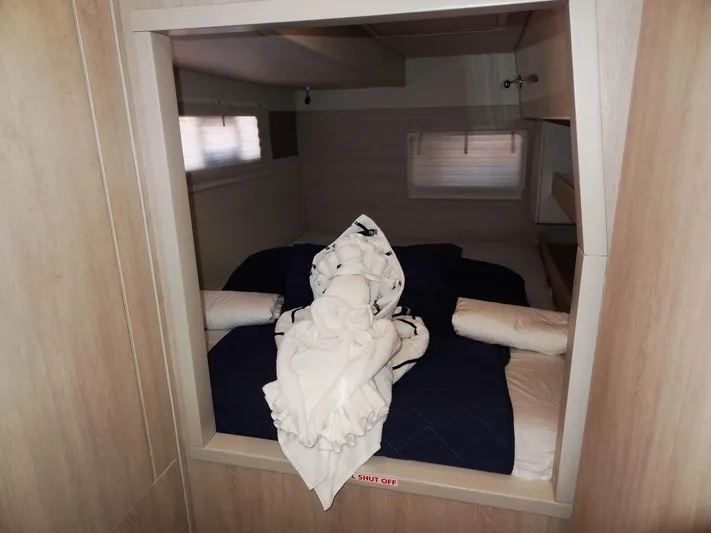 Livitup Yacht Photos Pics Cozy cabin interior of 2017 Leopard 43 Powercat with neatly arranged bedding.