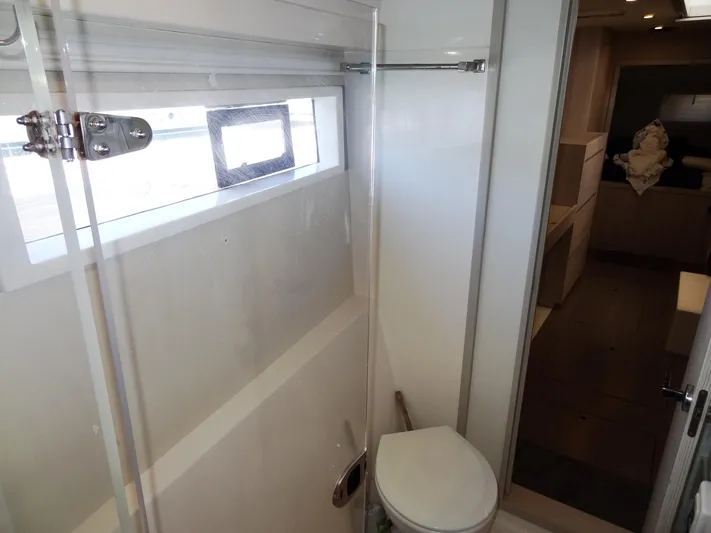 Livitup Yacht Photos Pics Bathroom interior of 2017 Leopard 43 Powercat yacht, featuring modern design and compact layout.