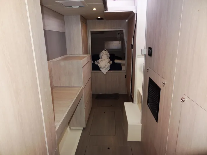 Livitup Yacht Photos Pics Interior of 2017 Leopard 43 Powercat yacht, featuring modern wood paneling and cozy cabin space.