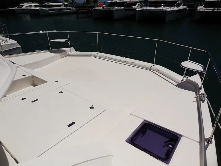 Livitup Yacht Photos Pics Leopard 43 Powercat 2017 yacht deck with storage compartments, docked in marina.