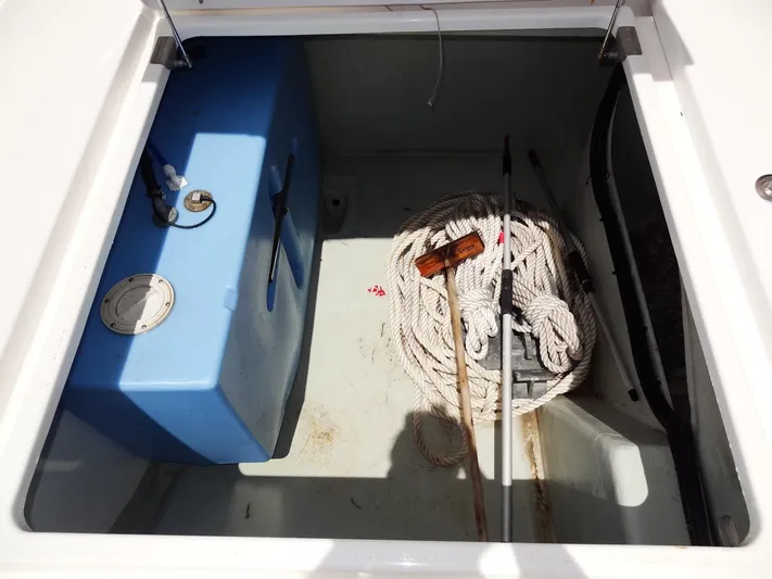 Livitup Yacht Photos Pics Storage compartment of 2017 Leopard 43 Powercat with rope and blue tank.