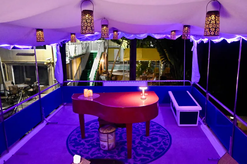 Amore Yacht Photos Pics Luxurious 1996 Catamaran Cruisers Aqua Cruiser 44 interior with elegant lighting and piano.