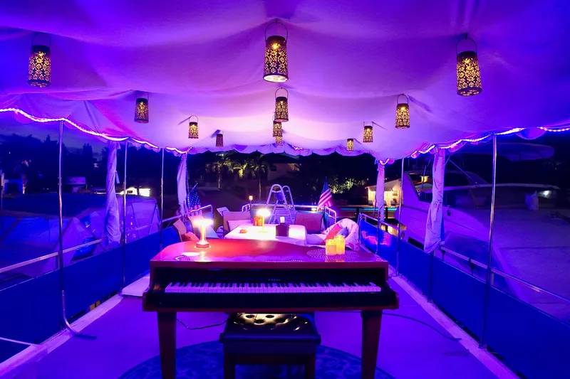 Amore Yacht Photos Pics Luxurious 1996 Catamaran Cruisers Aqua Cruiser 44 with elegant piano and ambient lighting.