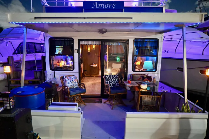 Amore Yacht Photos Pics 1996 Catamaran Cruisers Aqua Cruiser 44 with cozy, illuminated deck and seating area.