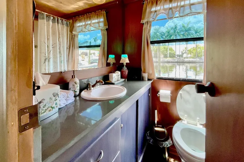 Amore Yacht Photos Pics Bathroom interior of 1996 Catamaran Cruisers Aqua Cruiser 44 with lake view.