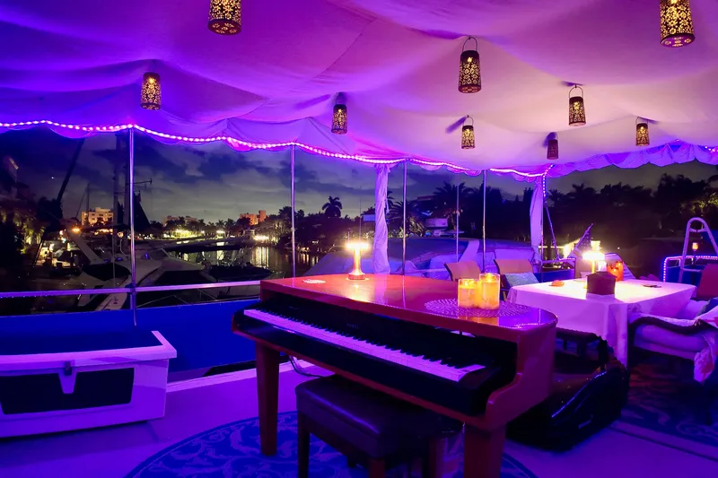 Amore Yacht Photos Pics Luxurious 1996 Catamaran Cruisers Aqua Cruiser 44 with elegant interior lighting and piano.