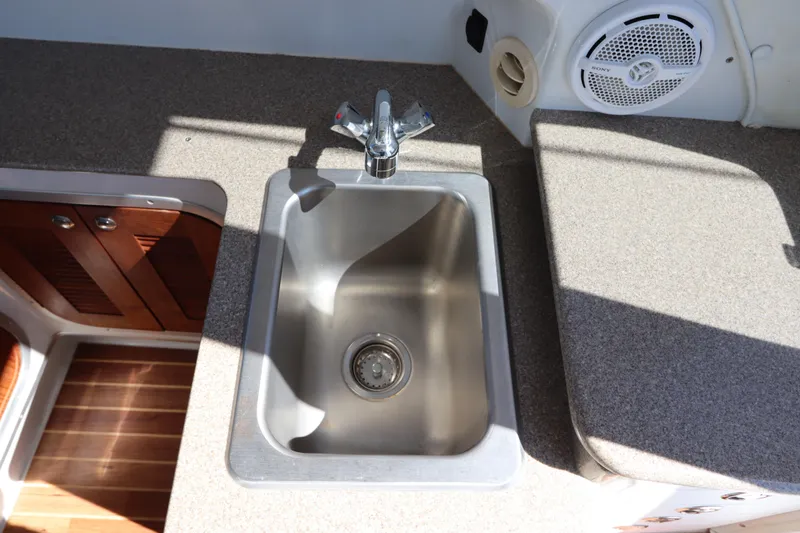  Yacht Photos Pics Stainless steel sink in 2008 Glacier Bay 3080 Coastal Runner boat kitchen.