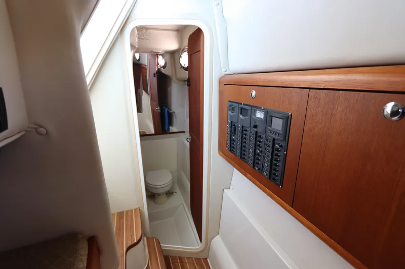  Yacht Photos Pics Interior of 2008 Glacier Bay 3080 Coastal Runner, featuring control panel and compact bathroom.