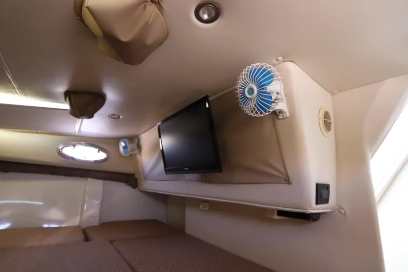  Yacht Photos Pics Interior cabin of 2008 Glacier Bay 3080 Coastal Runner with TV and fan.