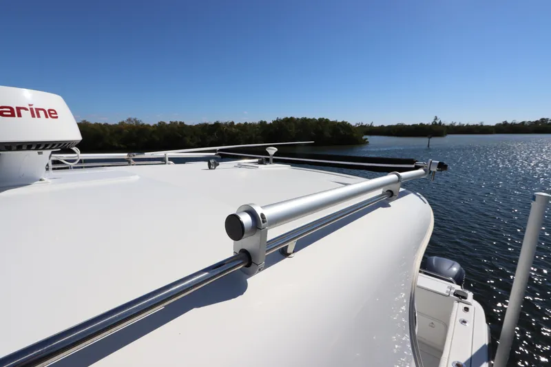  Yacht Photos Pics 2008 Glacier Bay 3080 Coastal Runner boat on calm water under clear blue sky.
