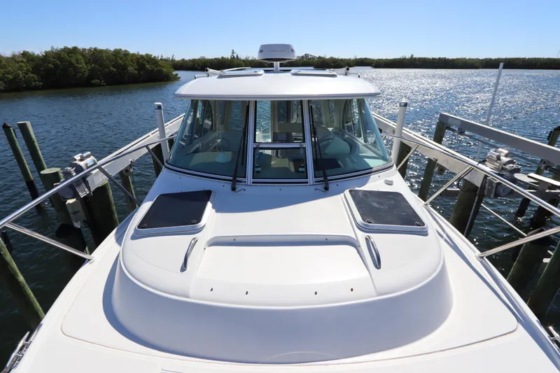  Yacht Photos Pics 2008 Glacier Bay 3080 Coastal Runner boat docked on a sunny day.