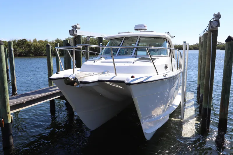  Yacht Photos Pics 2008 Glacier Bay 3080 Coastal Runner catamaran docked on a sunny day.