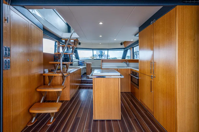 Three Wishes Yacht Photos Pics Interior of 2015 Maritimo M50 Motoryacht with wooden cabinetry and modern kitchen.