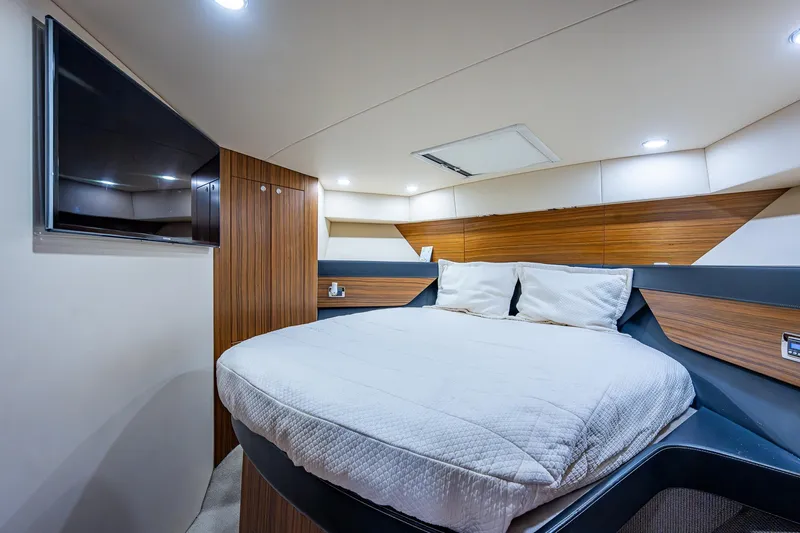 Three Wishes Yacht Photos Pics Luxurious bedroom in 2015 Maritimo M50 Motoryacht with modern design and cozy bedding.
