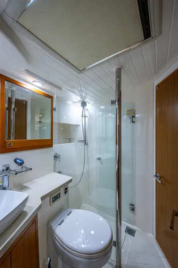 Three Wishes Yacht Photos Pics 2015 Maritimo M50 Motoryacht bathroom with modern fixtures and glass shower.