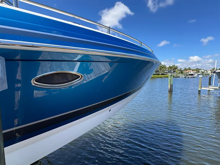 Uncorked Yacht Photos Pics 2023 Formula 350 Crossover Bowrider on water, showcasing sleek blue hull design.