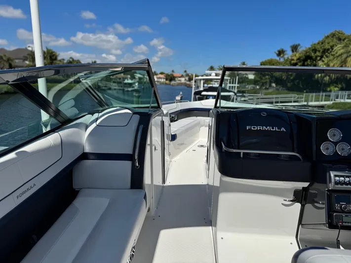 Uncorked Yacht Photos Pics 2023 Formula 350 Crossover Bowrider on a sunny day, showcasing sleek interior design.