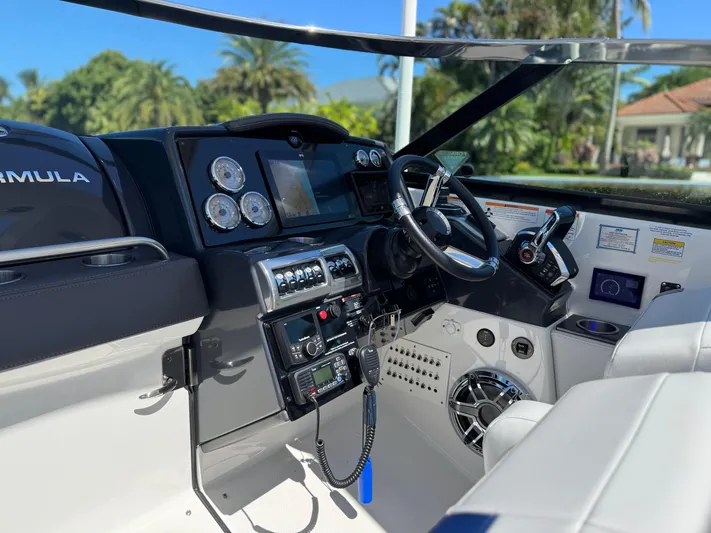 Uncorked Yacht Photos Pics 2023 Formula 350 Crossover Bowrider cockpit with modern controls and sleek design.