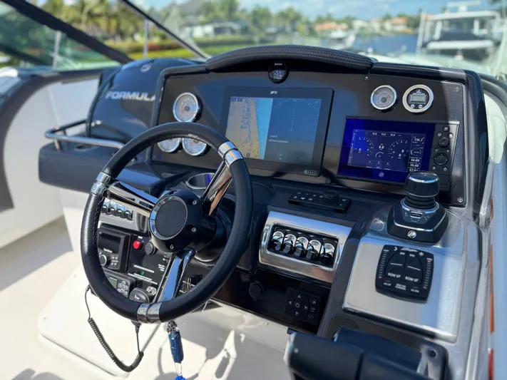 Uncorked Yacht Photos Pics 2023 Formula 350 Crossover Bowrider dashboard with advanced navigation and control systems.