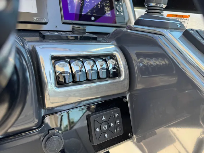 Uncorked Yacht Photos Pics 2023 Formula 350 Crossover Bowrider dashboard with control panel and navigation system.