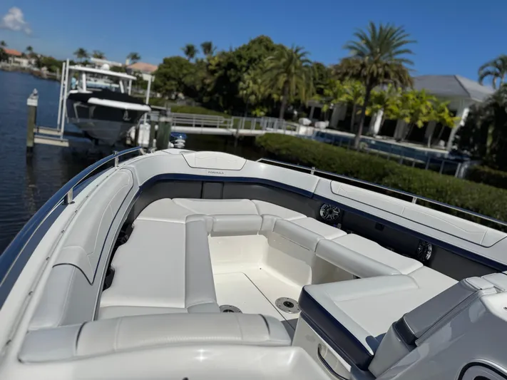 Uncorked Yacht Photos Pics 2023 Formula 350 Crossover Bowrider docked, featuring spacious seating and sleek design.
