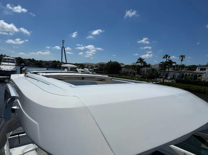 Uncorked Yacht Photos Pics 2023 Formula 350 Crossover Bowrider on water, clear sky, luxury boat design.