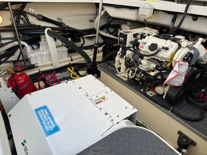 Uncorked Yacht Photos Pics Engine compartment of 2023 Formula 350 Crossover Bowrider with visible machinery and wiring.