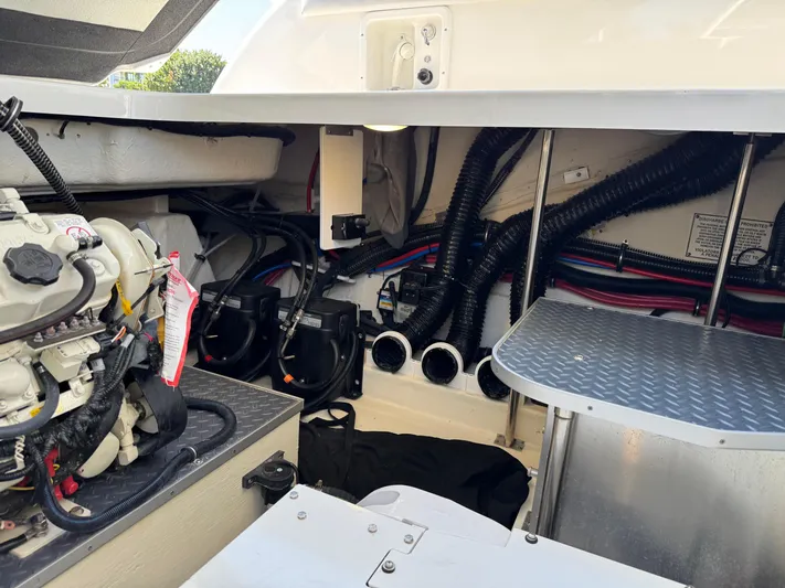 Uncorked Yacht Photos Pics Engine compartment of 2023 Formula 350 Crossover Bowrider with visible wiring and components.