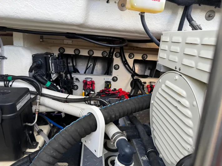 Uncorked Yacht Photos Pics Engine compartment of 2023 Formula 350 Crossover Bowrider, showcasing wiring and mechanical components.