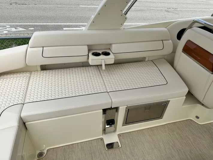  Yacht Photos Pics 2025 Chris-Craft Launch 31 GT boat interior with white cushioned seating and cup holders.