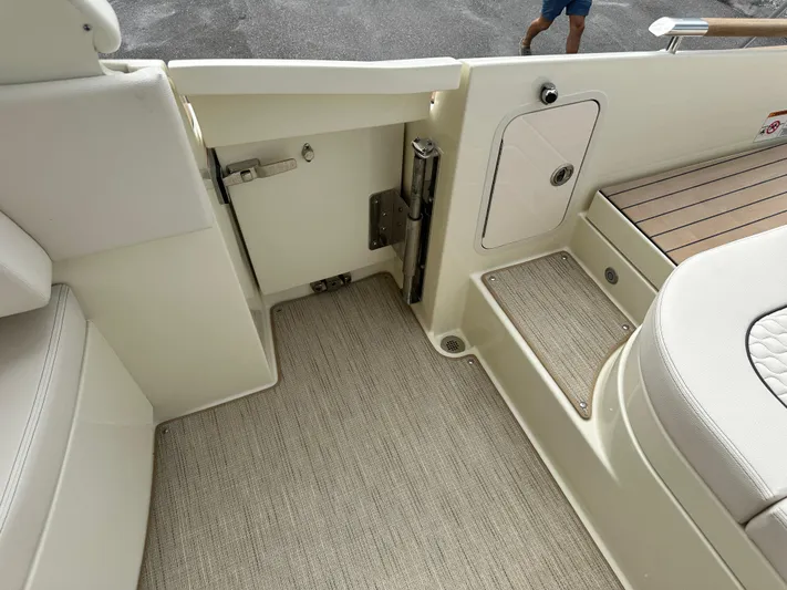  Yacht Photos Pics Interior view of 2025 Chris-Craft Launch 31 GT boat with beige upholstery and flooring.