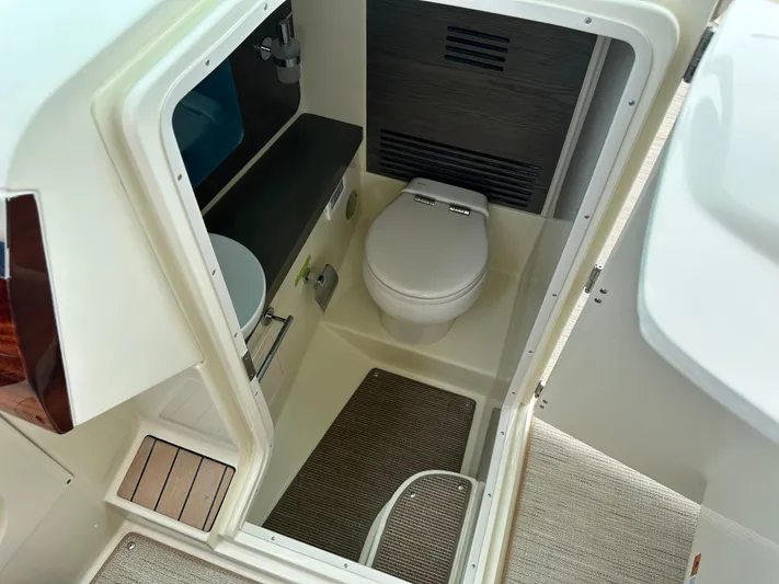  Yacht Photos Pics 2025 Chris-Craft Launch 31 GT boat interior bathroom with toilet and sink.