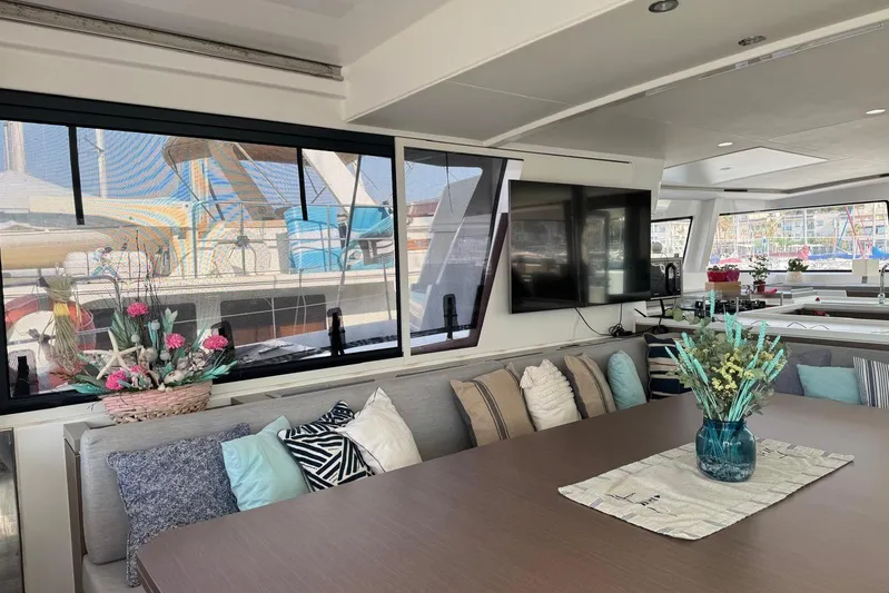 Amura Yacht Photos Pics Luxurious interior of 2021 Bali 5.4 Open Space yacht with elegant decor and large windows.