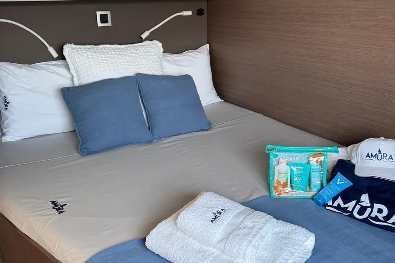 Amura Yacht Photos Pics Cozy bed setup on Bali 5.4 Open Space 2021 yacht with Amura branded items.