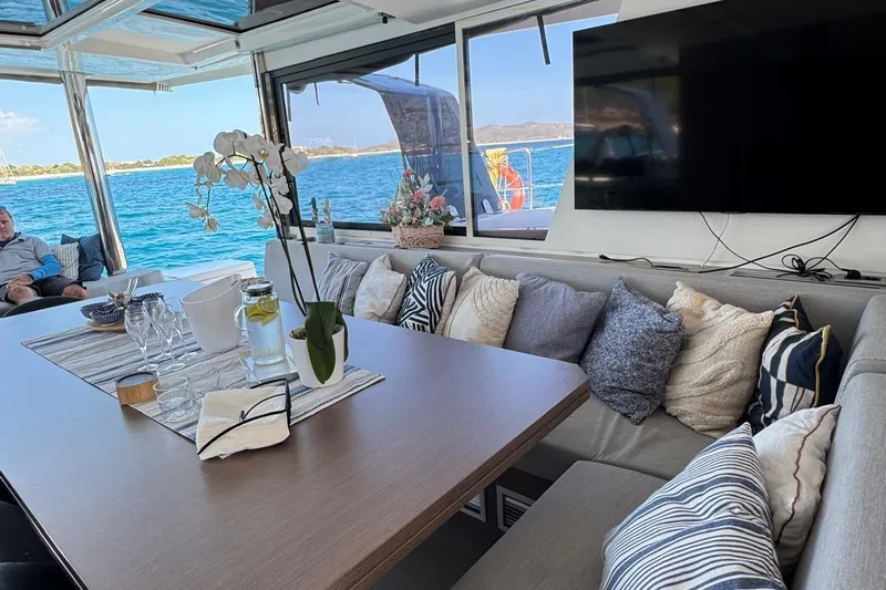 Amura Yacht Photos Pics Luxurious interior of 2021 Bali 5.4 Open Space yacht with ocean view and elegant decor.