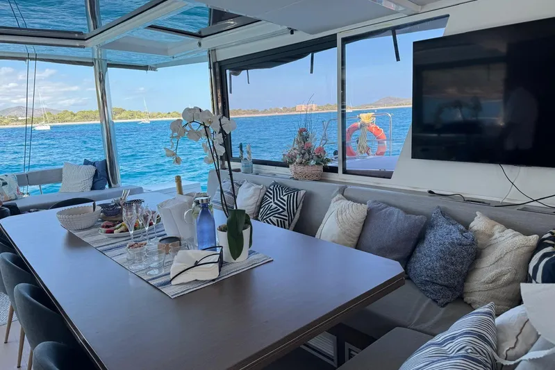 Amura Yacht Photos Pics Luxurious interior of 2021 Bali 5.4 Open Space yacht with ocean view and elegant decor.