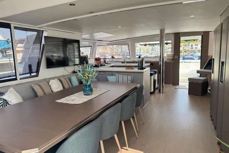 Amura Yacht Photos Pics Luxurious interior of 2021 Bali 5.4 Open Space yacht with modern dining and living area.