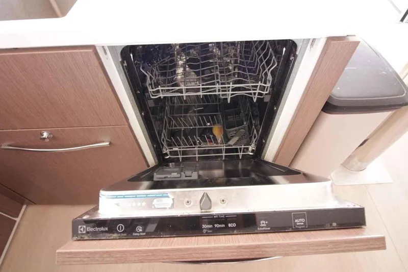 Amura Yacht Photos Pics Open dishwasher in Bali 5.4 Open Space 2021 model kitchen interior.