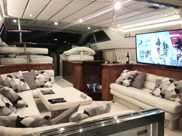 Ferretti 55 Yacht Photos Pics Luxurious interior of a 1998 Ferretti Yachts FERRETTI 55 with modern decor and entertainment system.