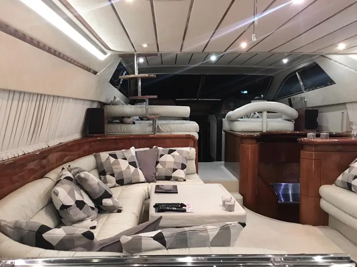Ferretti 55 Yacht Photos Pics Luxurious interior of a 1998 Ferretti Yachts FERRETTI 55, featuring elegant seating and modern design.