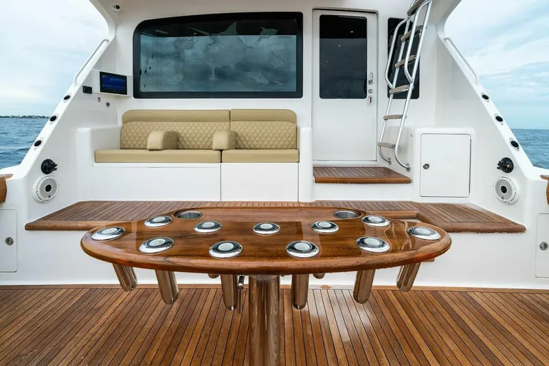 Knot On Call Yacht Photos Pics 2006 Viking 61 Convertible yacht interior with wooden deck and seating area.